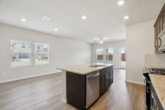 511 Willet Dr, Mckinney, TX 75069 - kitchen featuring a sink, appliances with stainless steel finishes, plenty of natural light, a kitchen island with sink, and recessed lighting