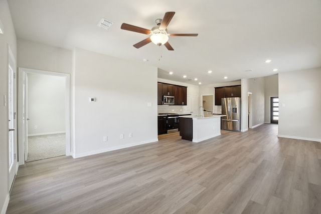 511 Willet Dr, Mckinney, TX 75069 - unfurnished living room with ceiling fan, recessed lighting, baseboards, light wood finished floors, and a sink