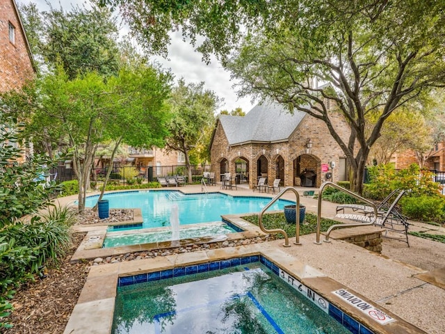 4138 Towne Green Cir, Addison, TX 75001 - community pool with a hot tub and a patio
