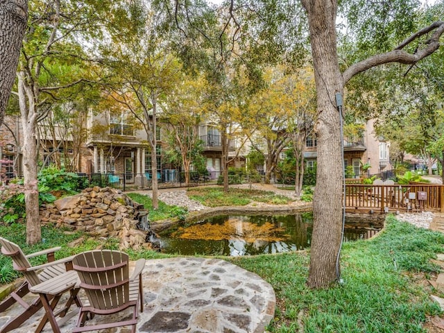 4138 Towne Green Cir, Addison, TX 75001 - view of yard featuring a garden pond