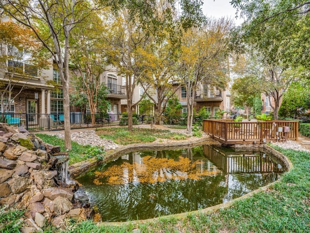 4138 Towne Green Cir, Addison, TX 75001 - surrounding community with a garden pond
