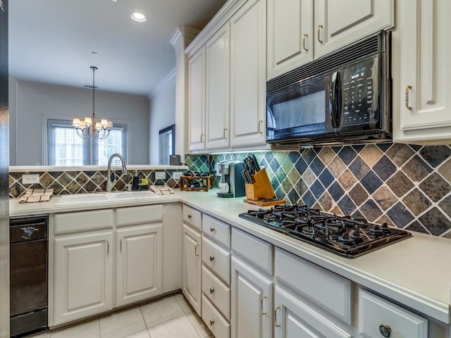 4138 Towne Green Cir, Addison, TX 75001 - kitchen featuring black appliances, a sink, ornamental molding, tasteful backsplash, and white cabinetry
