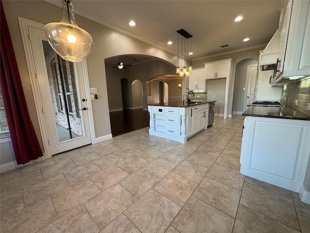 2802 Castlereach St, Trophy Club, TX 76262 - kitchen featuring arched walkways, dark countertops, ornamental molding, tasteful backsplash, and dishwasher