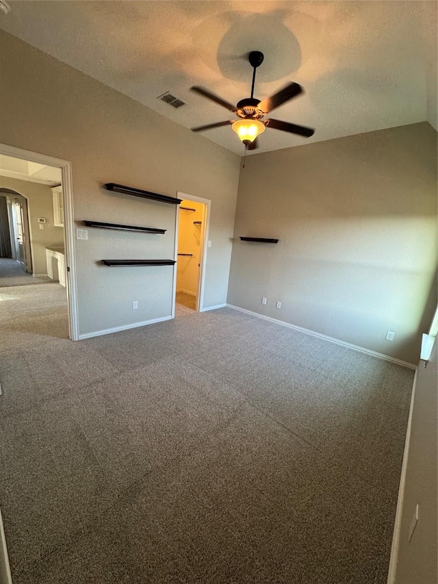 2802 Castlereach St, Trophy Club, TX 76262 - unfurnished bedroom featuring carpet floors, baseboards, arched walkways, and a textured ceiling