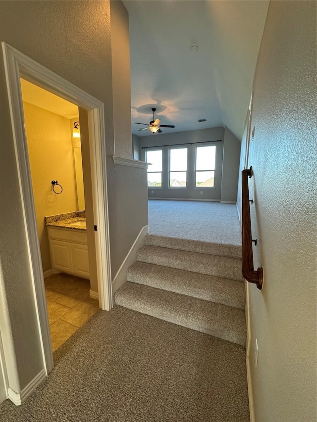 2802 Castlereach St, Trophy Club, TX 76262 - stairway with carpet, vaulted ceiling, baseboards, ceiling fan, and a textured wall