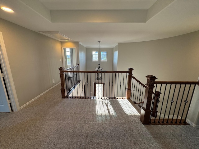 2802 Castlereach St, Trophy Club, TX 76262 - hallway featuring attic access, an upstairs landing, carpet floors, baseboards, and crown molding