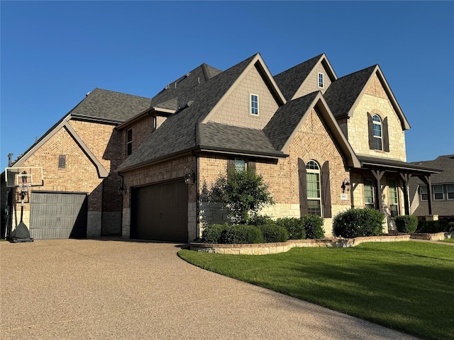2802 Castlereach St, Trophy Club, TX 76262 - view of front facade featuring roof with shingles, brick siding, a front lawn, concrete driveway, and a garage