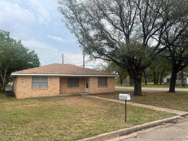 101 Oakland Dr, Lacy Lakeview, TX 76705 - ranch-style home featuring a front lawn, brick siding, and central air condition unit