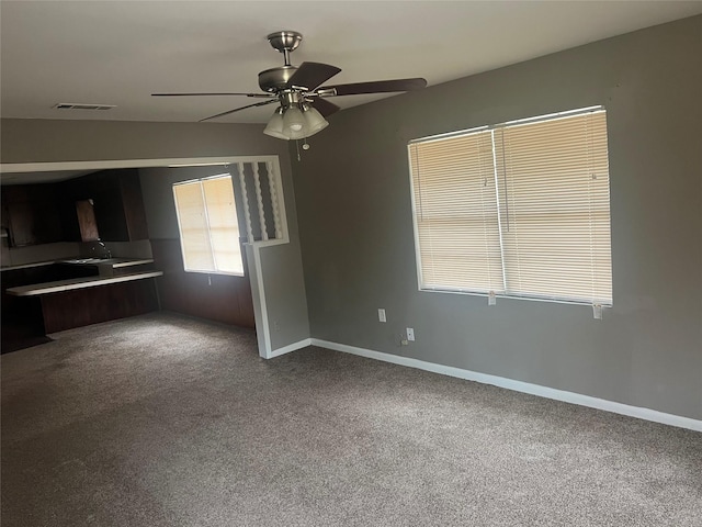 101 Oakland Dr, Lacy Lakeview, TX 76705 - unfurnished dining area with carpet flooring, ceiling fan, and baseboards