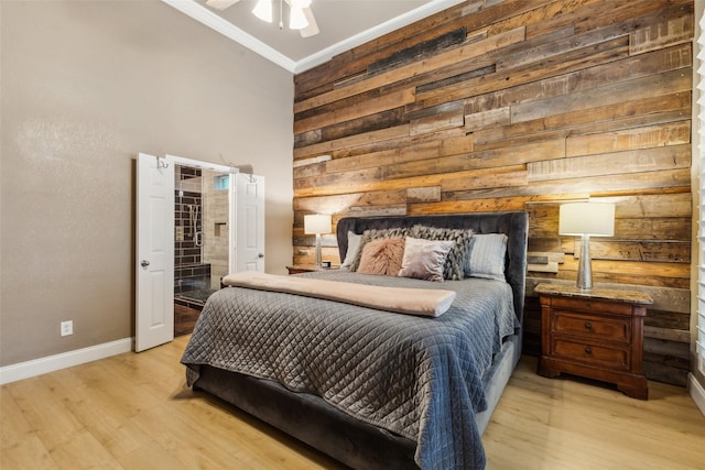 5213 Evening Sun Dr, Frisco, TX 75034 - bedroom with wood walls, light wood-style floors, crown molding, baseboards, and a towering ceiling