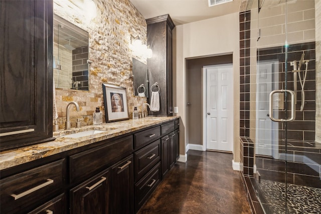 5213 Evening Sun Dr, Frisco, TX 75034 - bathroom featuring baseboards, a stall shower, double vanity, and finished concrete floors