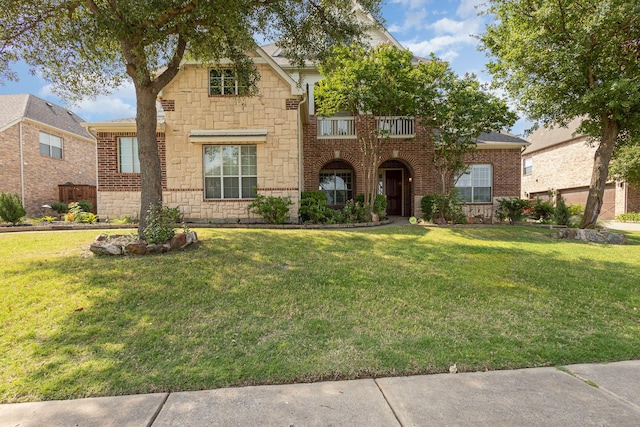 549 Verbena Ln, Frisco, TX 75036 - view of front of house featuring stone siding, a front lawn, and brick siding