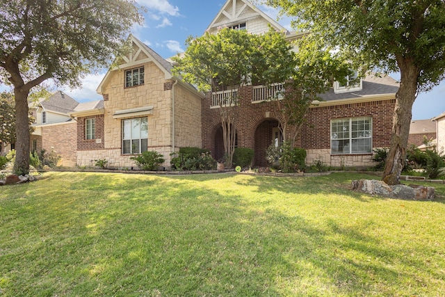 549 Verbena Ln, Frisco, TX 75036 - view of front of home with stone siding, a front lawn, and brick siding