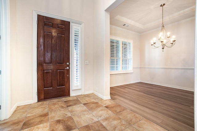 549 Verbena Ln, Frisco, TX 75036 - foyer entrance with a chandelier, crown molding, baseboards, and a tray ceiling