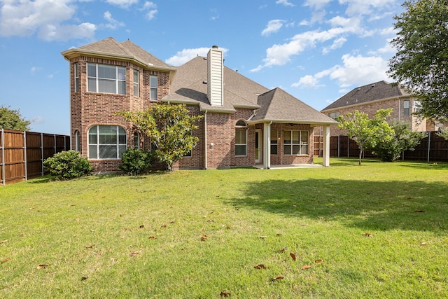 549 Verbena Ln, Frisco, TX 75036 - rear view of house featuring brick siding, a chimney, a patio area, and a shingled roof