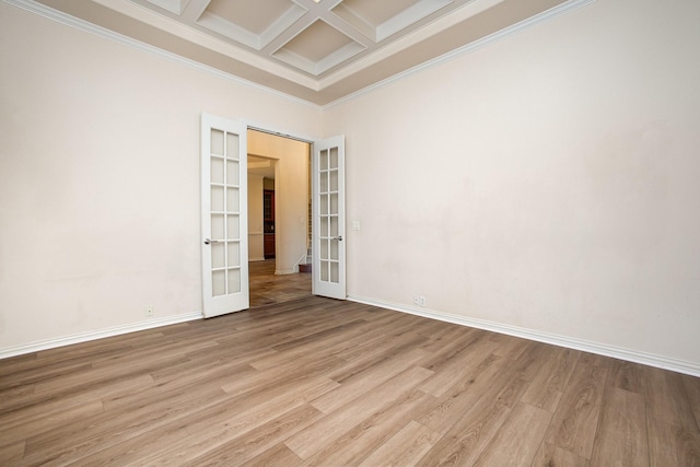 549 Verbena Ln, Frisco, TX 75036 - spare room featuring french doors, coffered ceiling, light wood-style flooring, crown molding, and beamed ceiling
