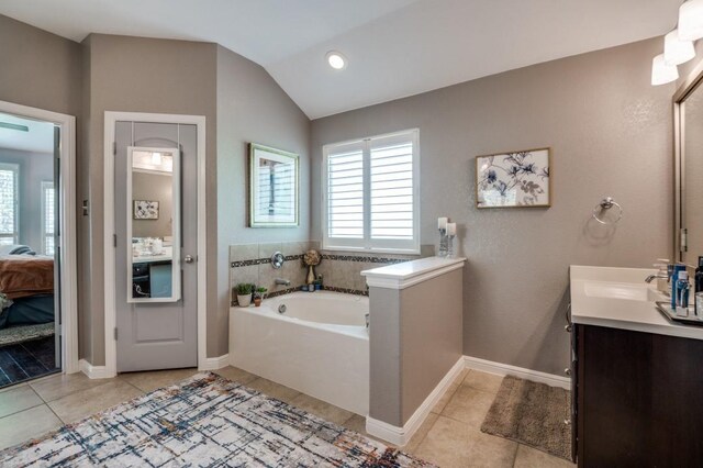 3103 Whispering Pine Blvd, Melissa, TX 75454 - full bath with a bath, tile patterned flooring, vanity, ensuite bathroom, and vaulted ceiling
