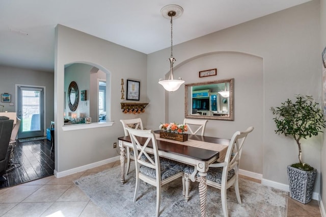 3103 Whispering Pine Blvd, Melissa, TX 75454 - dining space featuring arched walkways, baseboards, and light tile patterned floors