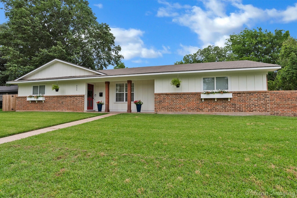 8629 Shelton Ave, Shreveport, LA 71115 - ranch-style house with brick siding, a front lawn, and board and batten siding