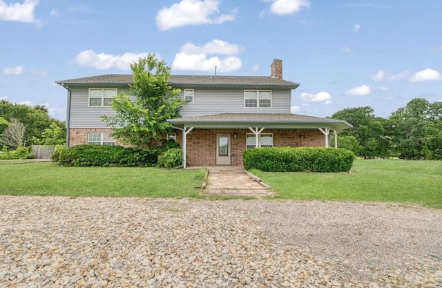1100 County Road 12200, Paris, TX 75462 - traditional-style home featuring a chimney, brick siding, a front yard, and a porch