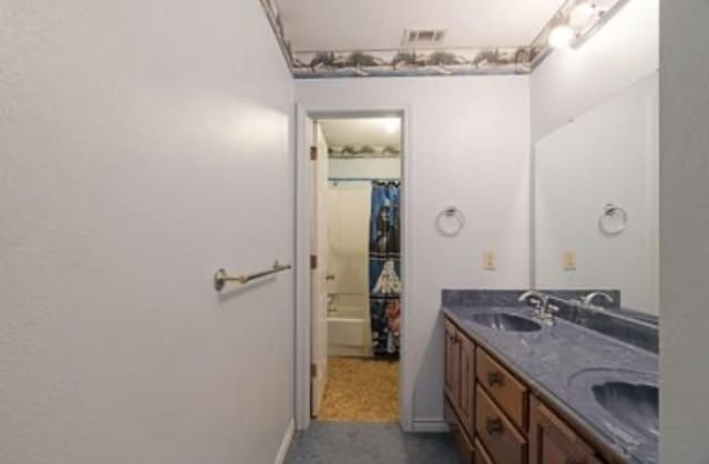 1100 County Road 12200, Paris, TX 75462 - full bath featuring double vanity and baseboards
