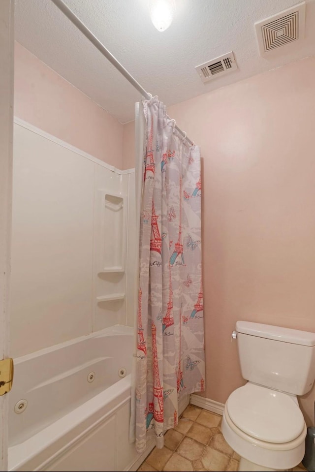 1100 County Road 12200, Paris, TX 75462 - bathroom featuring a combined bath / shower with jetted tub, toilet, baseboards, and tile patterned floors