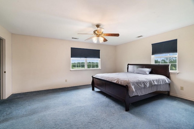 1100 County Road 12200, Paris, TX 75462 - bedroom with multiple windows, baseboards, carpet floors, and a ceiling fan