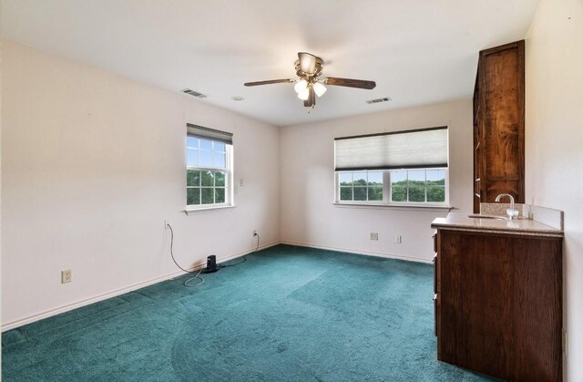 1100 County Road 12200, Paris, TX 75462 - spare room with carpet, ceiling fan, a sink, and baseboards