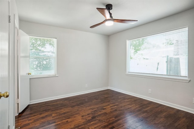 4809 Ira St, Haltom City, TX 76117 - spare room with healthy amount of natural light, dark wood-type flooring, ceiling fan, and baseboards