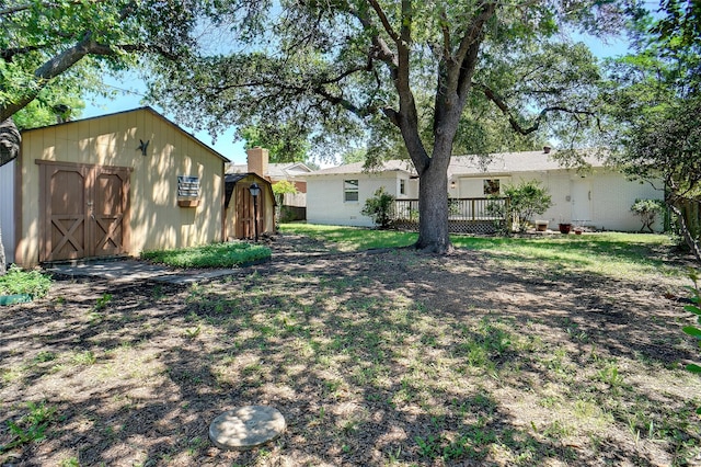 4809 Ira St, Haltom City, TX 76117 - view of grassy yard featuring a wooden deck