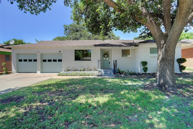 4809 Ira St, Haltom City, TX 76117 - single story home featuring a garage, concrete driveway, brick siding, and a front yard