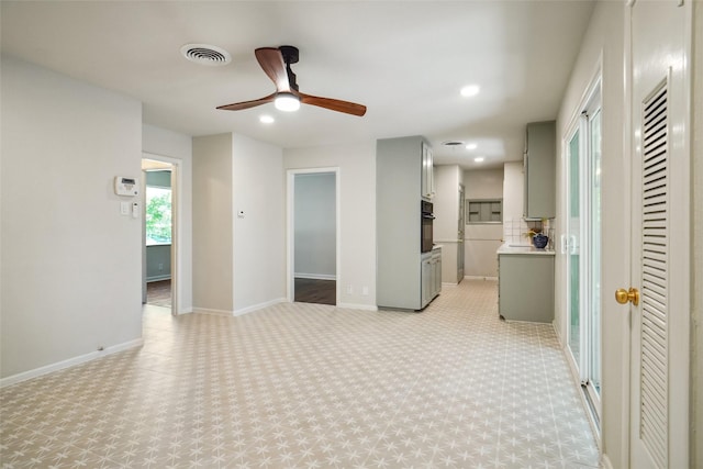 4809 Ira St, Haltom City, TX 76117 - unfurnished living room with a ceiling fan, baseboards, and recessed lighting