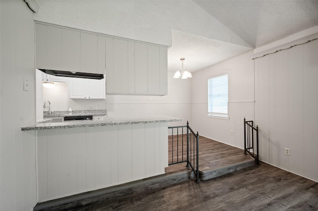 230 NE Craig St, Burleson, TX 76028 - kitchen featuring dark wood finished floors, a textured ceiling, a chandelier, a sink, and white cabinets