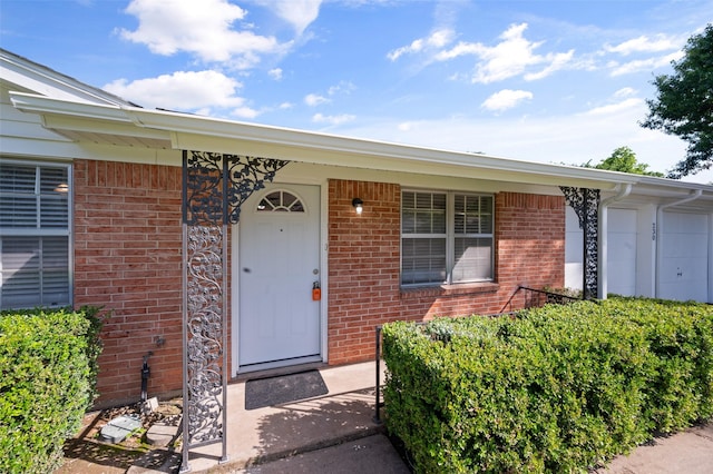 230 NE Craig St, Burleson, TX 76028 - doorway to property with brick siding
