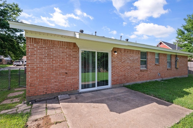 230 NE Craig St, Burleson, TX 76028 - back of house with brick siding and a patio