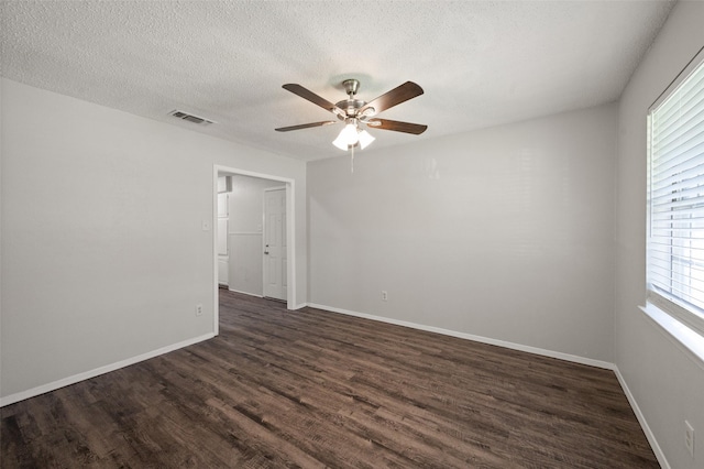 230 NE Craig St, Burleson, TX 76028 - spare room with a ceiling fan, dark wood-type flooring, a textured ceiling, and baseboards