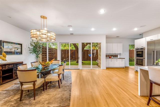 5624 Melshire Dr, Dallas, TX 75230 - dining space with light wood finished floors and recessed lighting