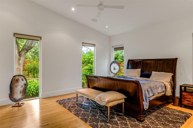 5624 Melshire Dr, Dallas, TX 75230 - bedroom with vaulted ceiling, multiple windows, wood finished floors, baseboards, and recessed lighting