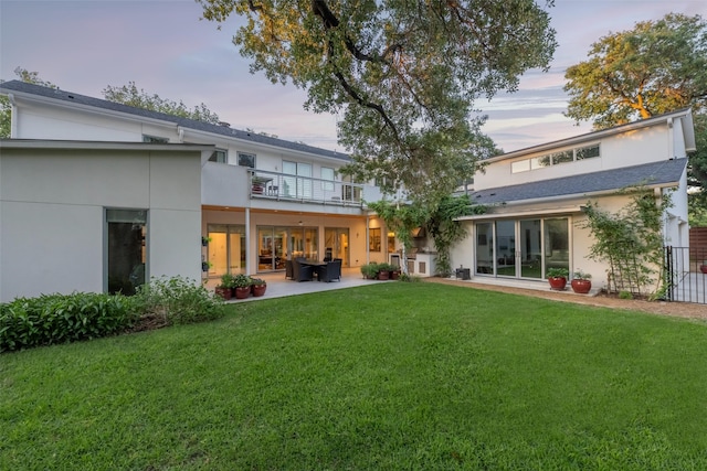 5624 Melshire Dr, Dallas, TX 75230 - rear view of property with a balcony, stucco siding, a lawn, and a patio
