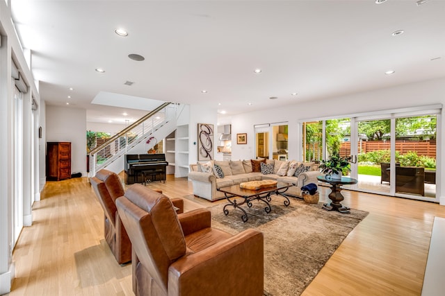 5624 Melshire Dr, Dallas, TX 75230 - living area featuring stairs, light wood-style flooring, and recessed lighting