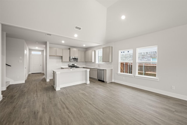 6728 Rockshire, Fort Worth, TX 76123 - kitchen with stainless steel appliances, gray cabinetry, recessed lighting, light countertops, and wood finished floors