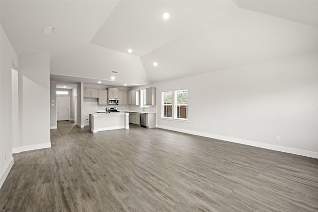 6728 Rockshire, Fort Worth, TX 76123 - unfurnished living room featuring recessed lighting, wood finished floors, and high vaulted ceiling