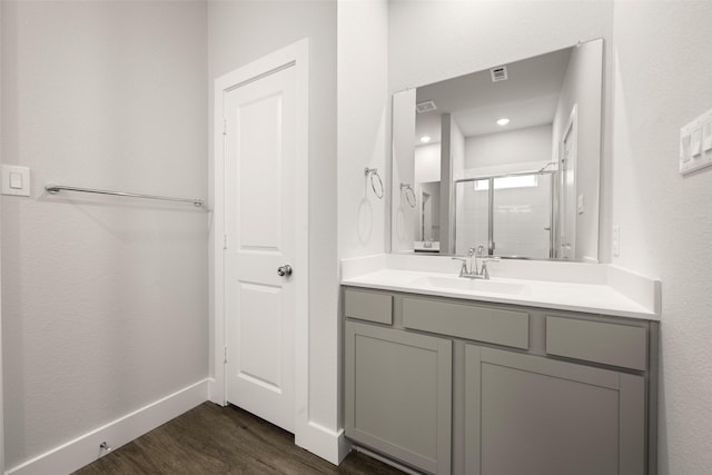 6728 Rockshire, Fort Worth, TX 76123 - bathroom with wood finished floors, a stall shower, and vanity