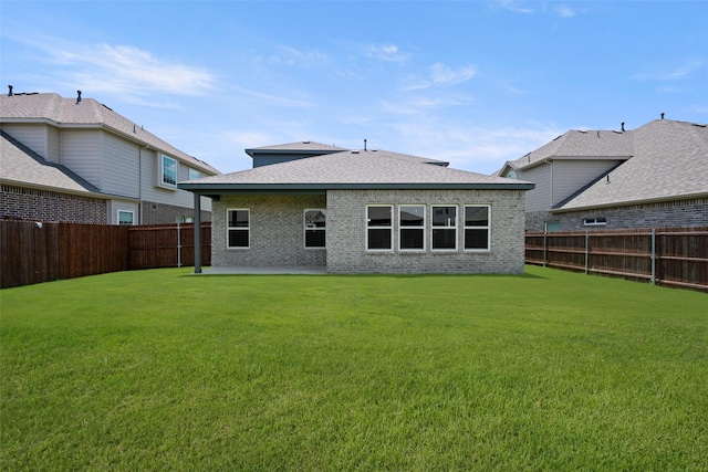6728 Rockshire, Fort Worth, TX 76123 - back of house featuring a fenced backyard, a patio, brick siding, and a shingled roof