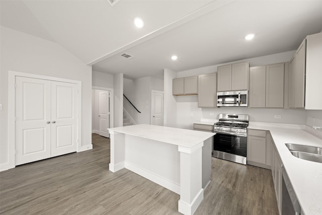 6728 Rockshire, Fort Worth, TX 76123 - kitchen featuring stainless steel appliances, gray cabinetry, light wood-style flooring, light countertops, and recessed lighting