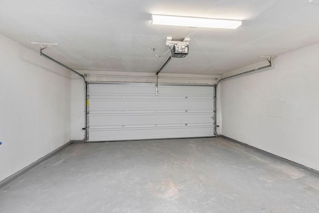 2031 Kings Rd, Carrollton, TX 75007 - garage featuring a garage door opener