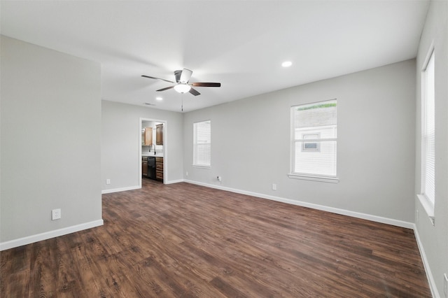 1625 Walnut St, Grand Prairie, TX 75050 - empty room featuring healthy amount of natural light, ceiling fan, dark wood finished floors, and recessed lighting