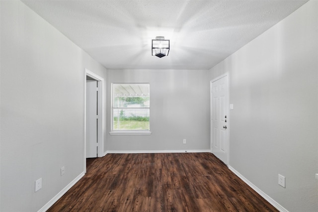 1625 Walnut St, Grand Prairie, TX 75050 - empty room featuring dark wood finished floors and baseboards
