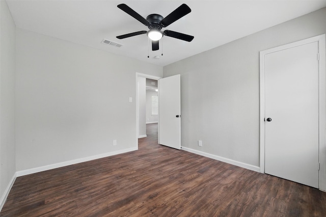1625 Walnut St, Grand Prairie, TX 75050 - unfurnished bedroom with wood finished floors, baseboards, and ceiling fan