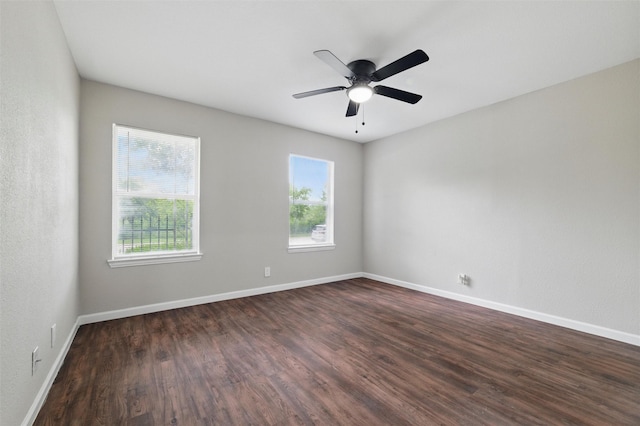 1625 Walnut St, Grand Prairie, TX 75050 - empty room with dark wood-style floors, baseboards, and a ceiling fan